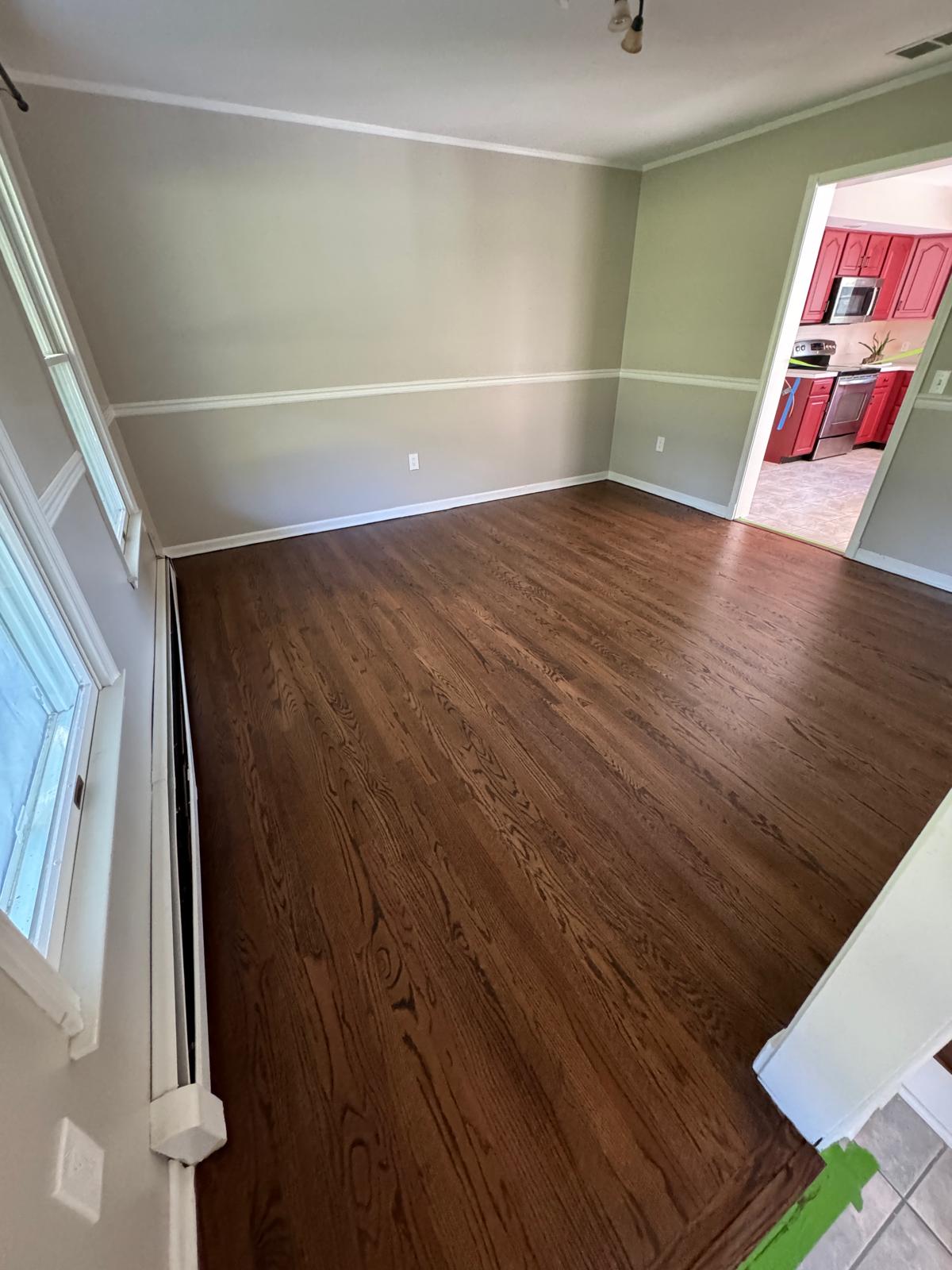 Dark stained hardwood floor in a dining room